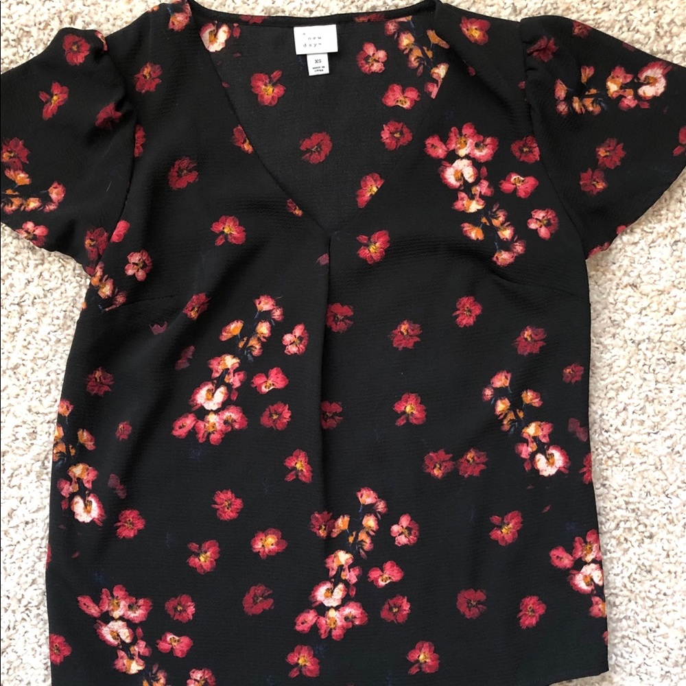 Black floral blouse.
